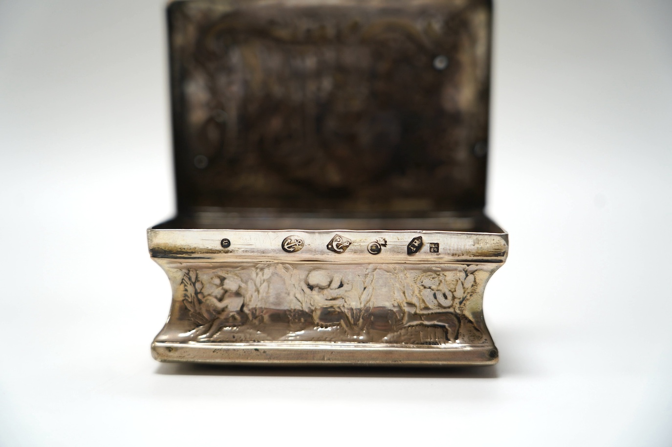 A late 19th century Dutch embossed white metal rectangular snuff box, 83mm, 107 grams. Condition - poor